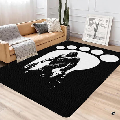 Modern lounge interior with leather couch and cactus featuring black and white sasquatch footprint rug - thumbnail image 2 of 5