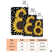Overhead view of a floral floor carpet displaying vibrant yellow sunflower prints over contrasting black styling. - thumbnail image 3 of 7