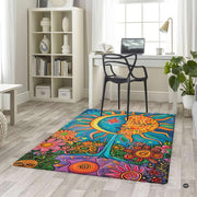 Lifestyle scene featuring family lounging on celestial boho sun moon area rug. - thumbnail image 5 of 5