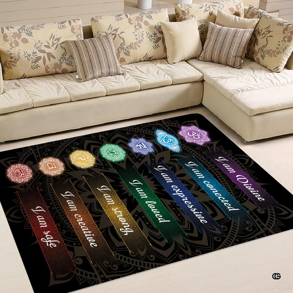 Seven chakras mandala area rug displaying rainbow energy bands in front of a sectional couch.