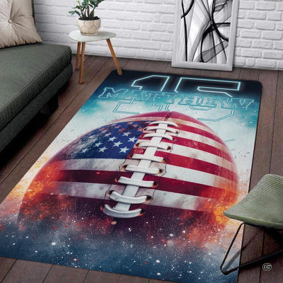 American football area rug with stars, stripes, and fiery nebula graphics.