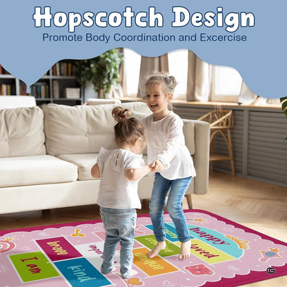Close-up of vibrant cyan and magenta decorative accent squares on a blush pink decorative area rug. - thumbnail image 4 of 9