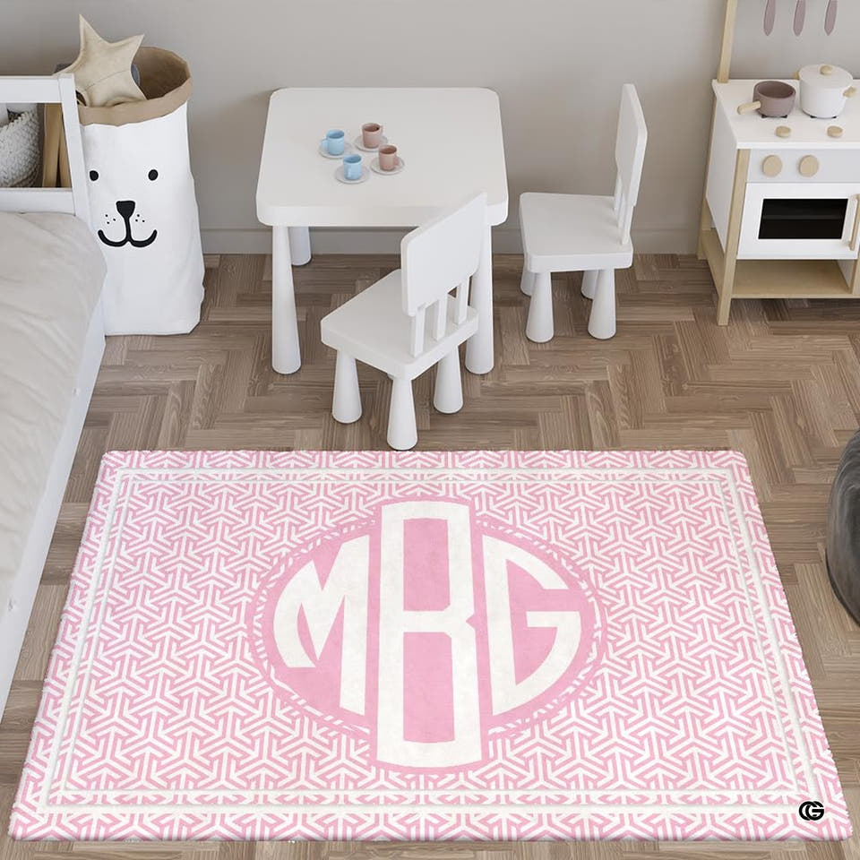 Pink geometric medallion rug in a bright playroom