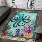 Nautical sea life area rug displaying a turquoise octopus centerpiece with vintage map script on parchment backdrop.