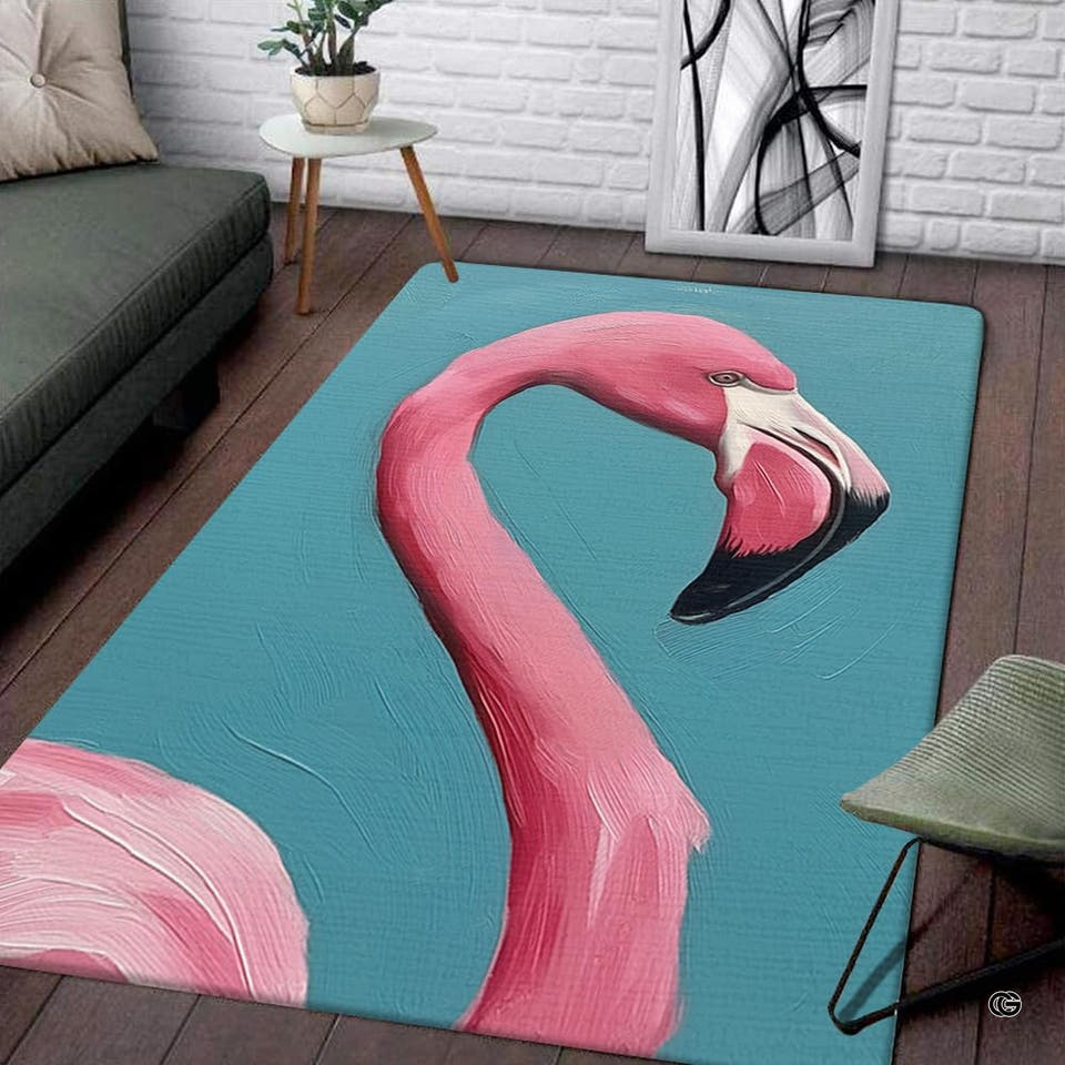 Living room display of a rectangular painterly pink flamingo area rug on turquoise background.