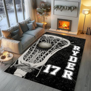 Close-up view of strung mesh stick head and ball design on dark floor accent. - thumbnail image 3 of 9