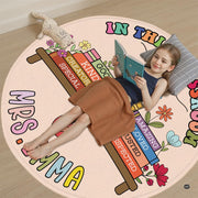 Circular welcome floor accent styled beside educational seating and botanical decor. - thumbnail image 6 of 9