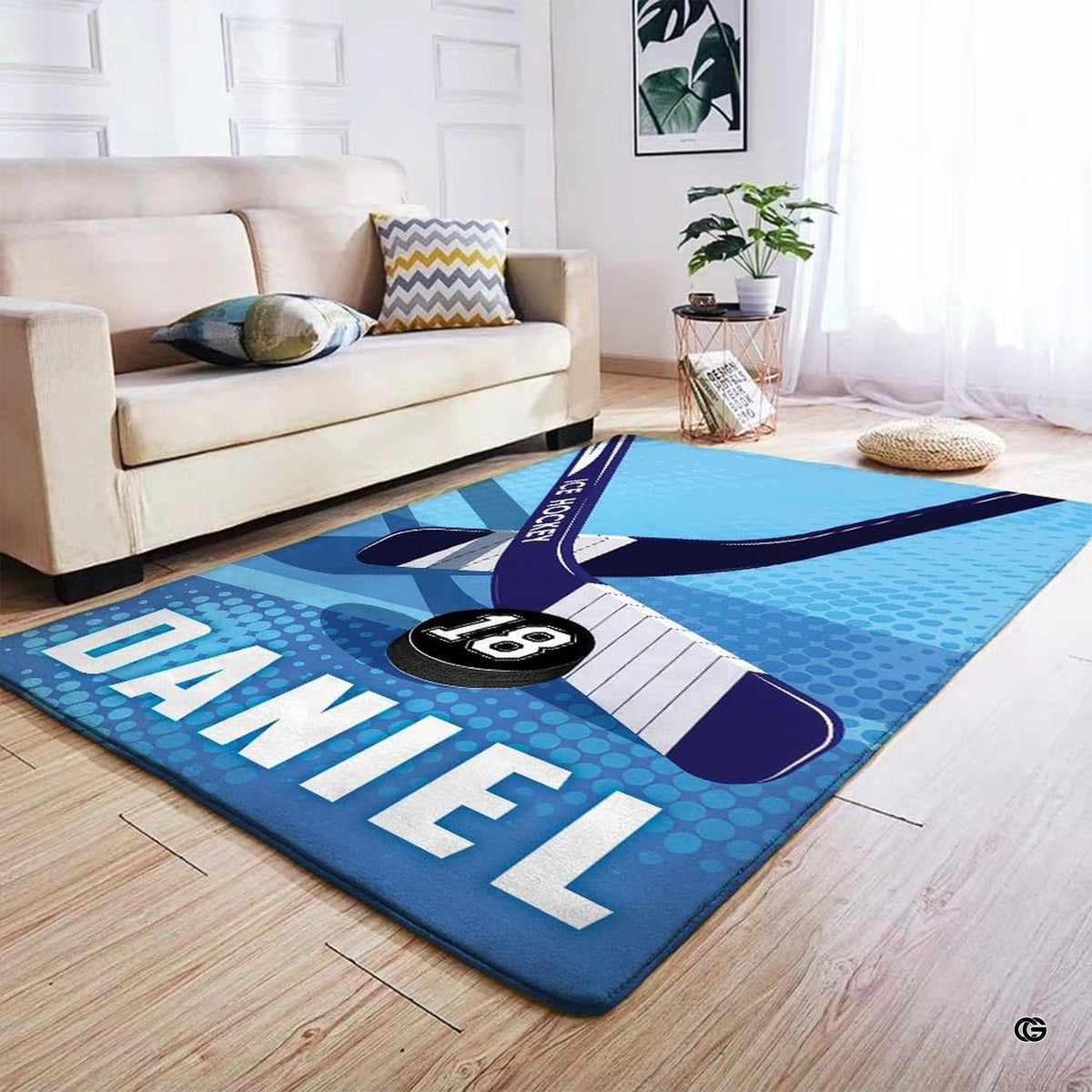 Living room setting featuring modern graphic area rug styled alongside sleek contemporary furniture.