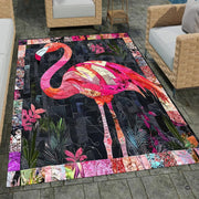 Outdoor patio stone lounge setting displaying the tropical pink flamingo patchwork area rug - thumbnail image 7 of 8