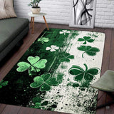 Top view of grunge clover area rug featuring emerald and cream split-tone backdrop with floating shamrocks.