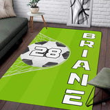 Modern living room floor setting featuring a green soccer pitch goal net athletic area rug