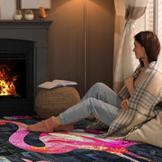 Cozy fireside reading nook with a person relaxing on the flamingo quilt floral floor rug - thumbnail image 8 of 8