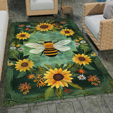 Stone patio setting featuring an emerald green honeybee sunflower wreath botanical area rug
