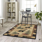 Overhead layout view of the rectangular woodland bear and pinecone patchwork wildlife area rug - thumbnail image 5 of 5