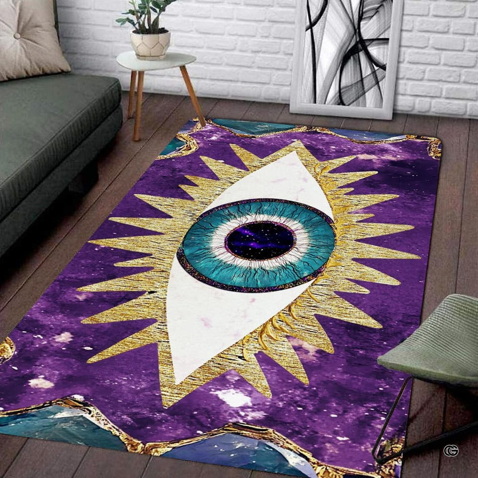 Celestial evil eye area rug featuring turquoise iris, radiant golden sunbeams, and purple galaxy background.