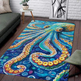 Vibrant octopus ocean creature rug displaying swirling painterly tentacles in turquoise, gold, and deep blue.