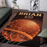 Geometric polygonal basketball swishing through glowing hoop rectangular area rug.