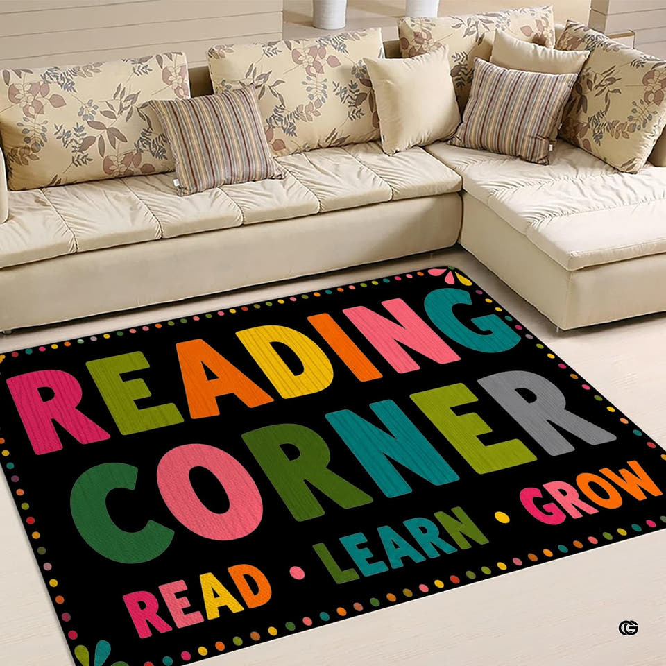 Classroom area rug featuring playful alphabet motifs, books, and stars in bright pastel tones.