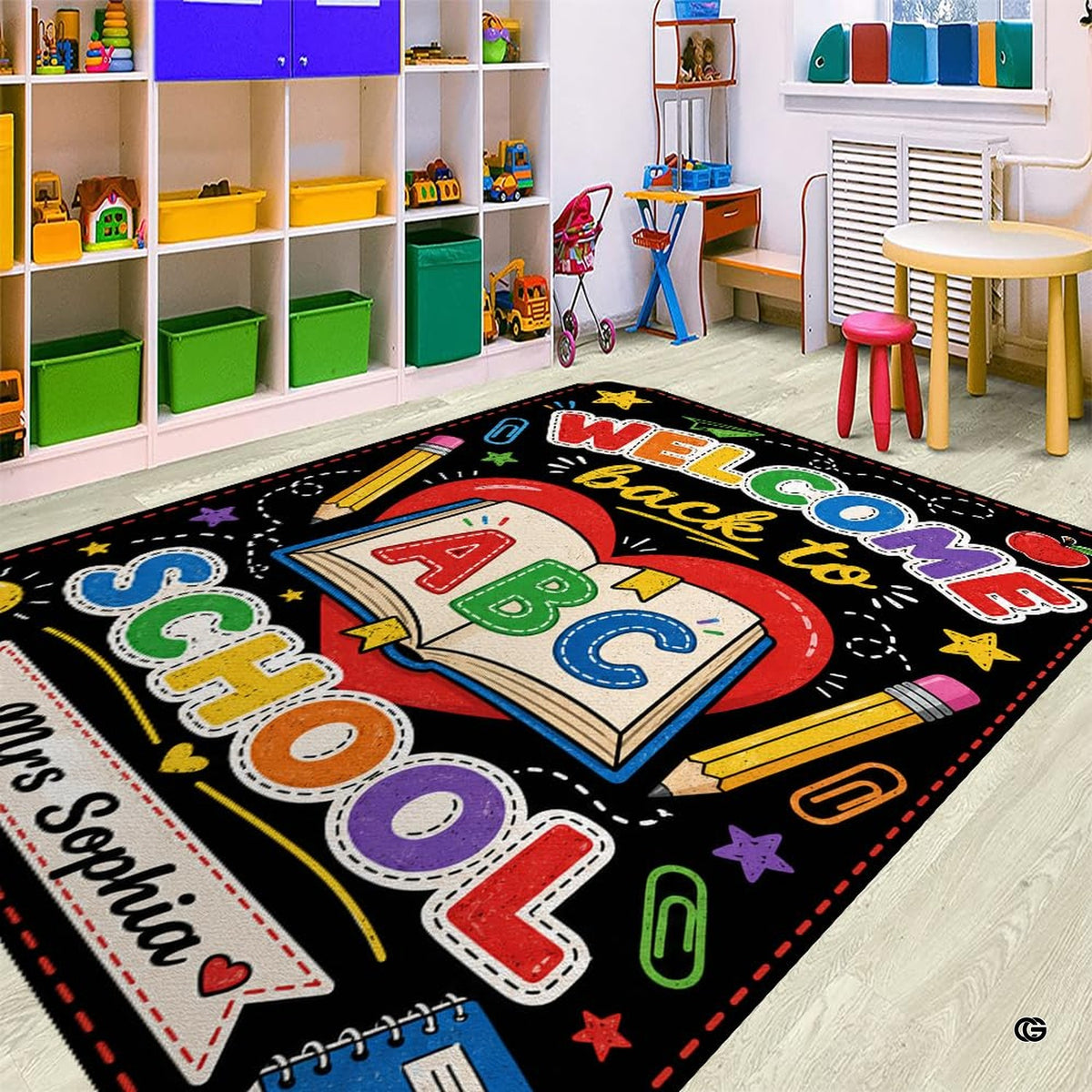 Classroom stationery motif rug styled beneath a wooden desk in a quiet study nook.