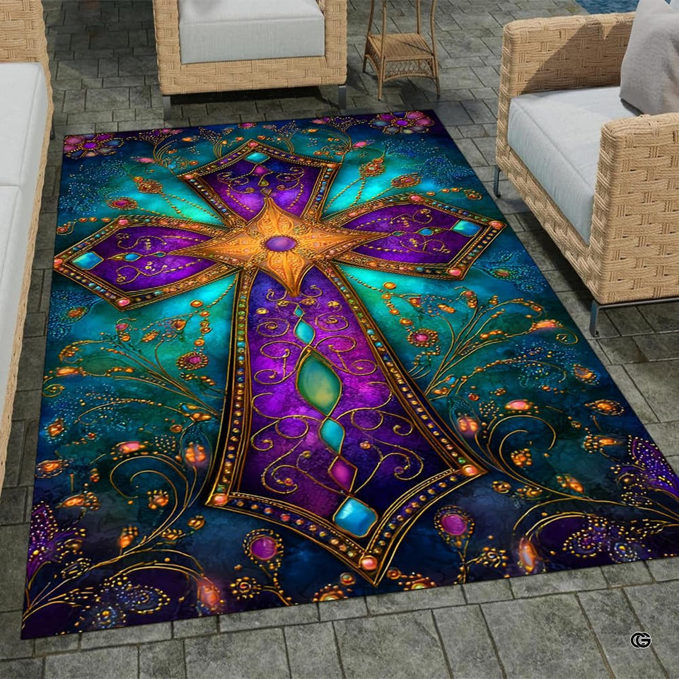 Ornate jeweled purple and teal cross area rug laid out on a patio floor