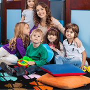 Close-up detail of crayon-shaped bows and polka dots on decorative classroom area rug. - thumbnail image 4 of 7