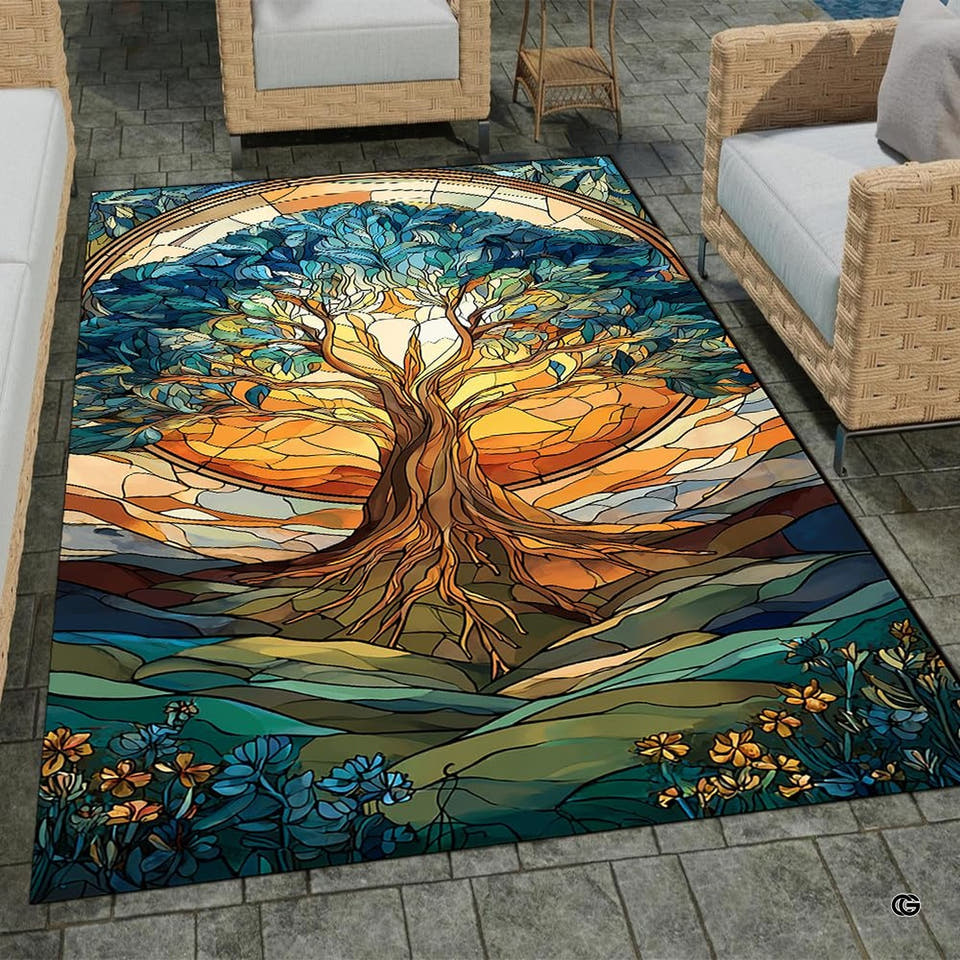 Patio stone lounge with wicker seating displaying the stained glass sunset Tree of Life area rug