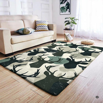 Overhead view of green pattern area rug displaying repeating buck artwork and muted sage camo shapes. - thumbnail image 4 of 7