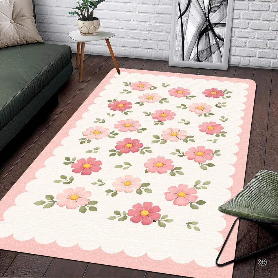 Pink floral rug for nursery featuring blush blossoms and scalloped pastel border.