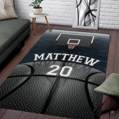 Basketball area rug displaying dark wood plank graphics and textured ball artwork in a sports themed bedroom. - thumbnail image 1 of 7