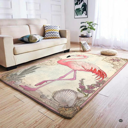 Overhead perspective of coastal bird rug displaying pink flamingo, seashells, and nautical topography. - thumbnail image 5 of 7