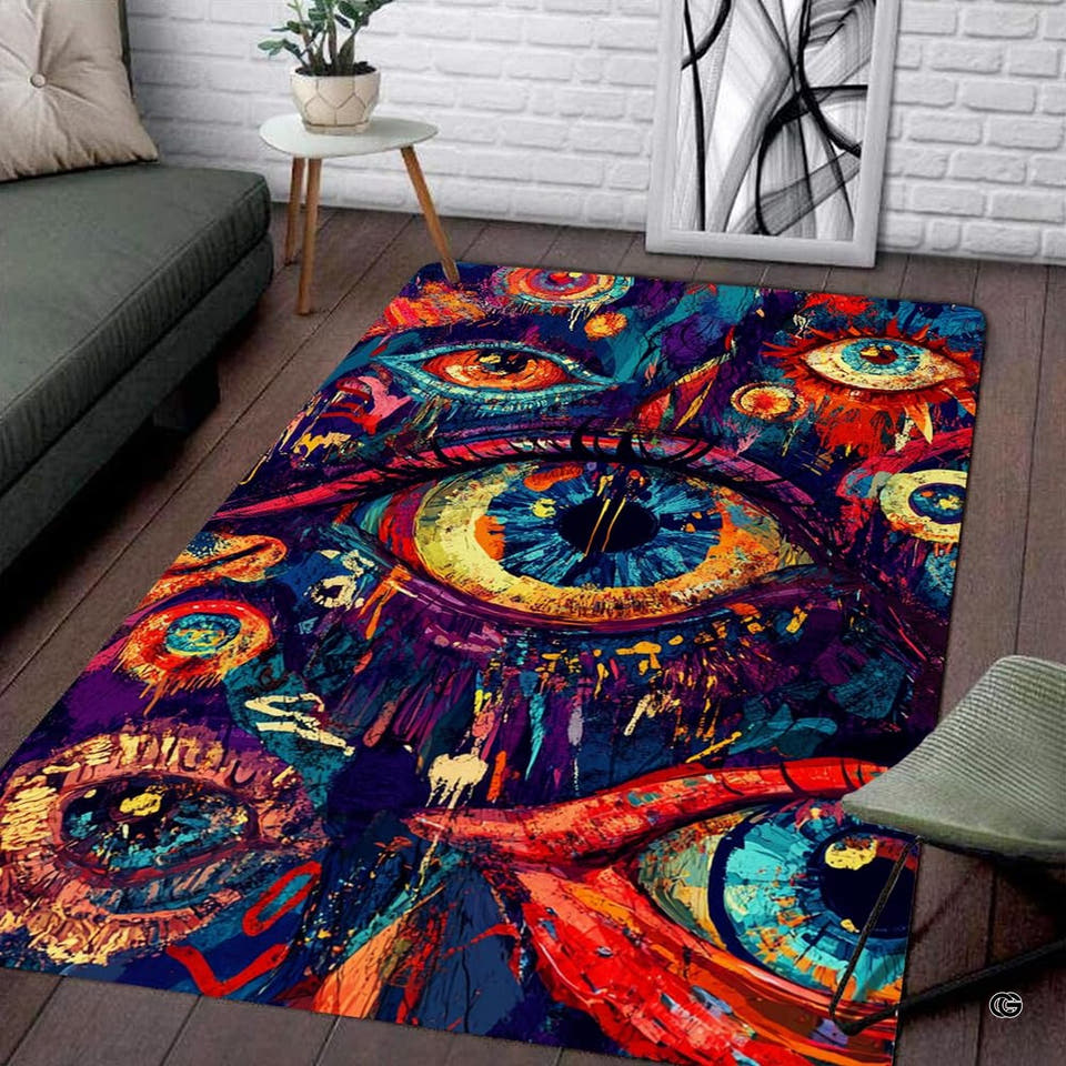 Surreal eye art pink psychedelic area rug showcasing colorful dripping paint splatters in a living space.