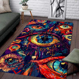 Surreal eye art pink psychedelic area rug showcasing colorful dripping paint splatters in a living space.