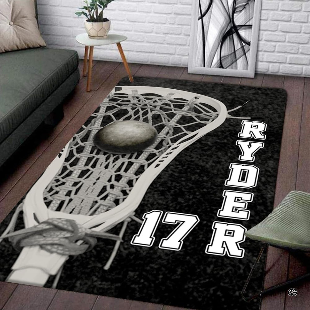 Lacrosse stick head holding a ball graphic artwork on black athletic area rug.