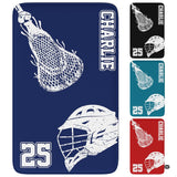 Lacrosse helmet and stick graphic displayed on a navy blue athletic area rug