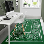 Corner angle displaying geometric frame lines and ornamental scroll borders on green bandana rug. - thumbnail image 5 of 9