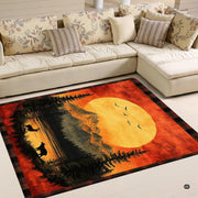 Close-up detail of plaid border and sunset mountain wildlife print on rustic area rug. - thumbnail image 4 of 5