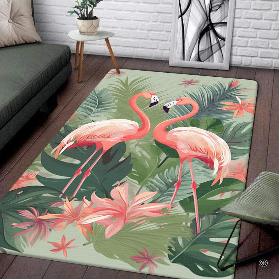 Tropical botanical pair of flamingos rectangular area rug positioned on hardwood flooring near an armchair.