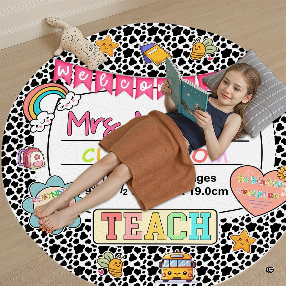 Overhead angle of cow print decorative accent displaying pastel accents and black and white border print.