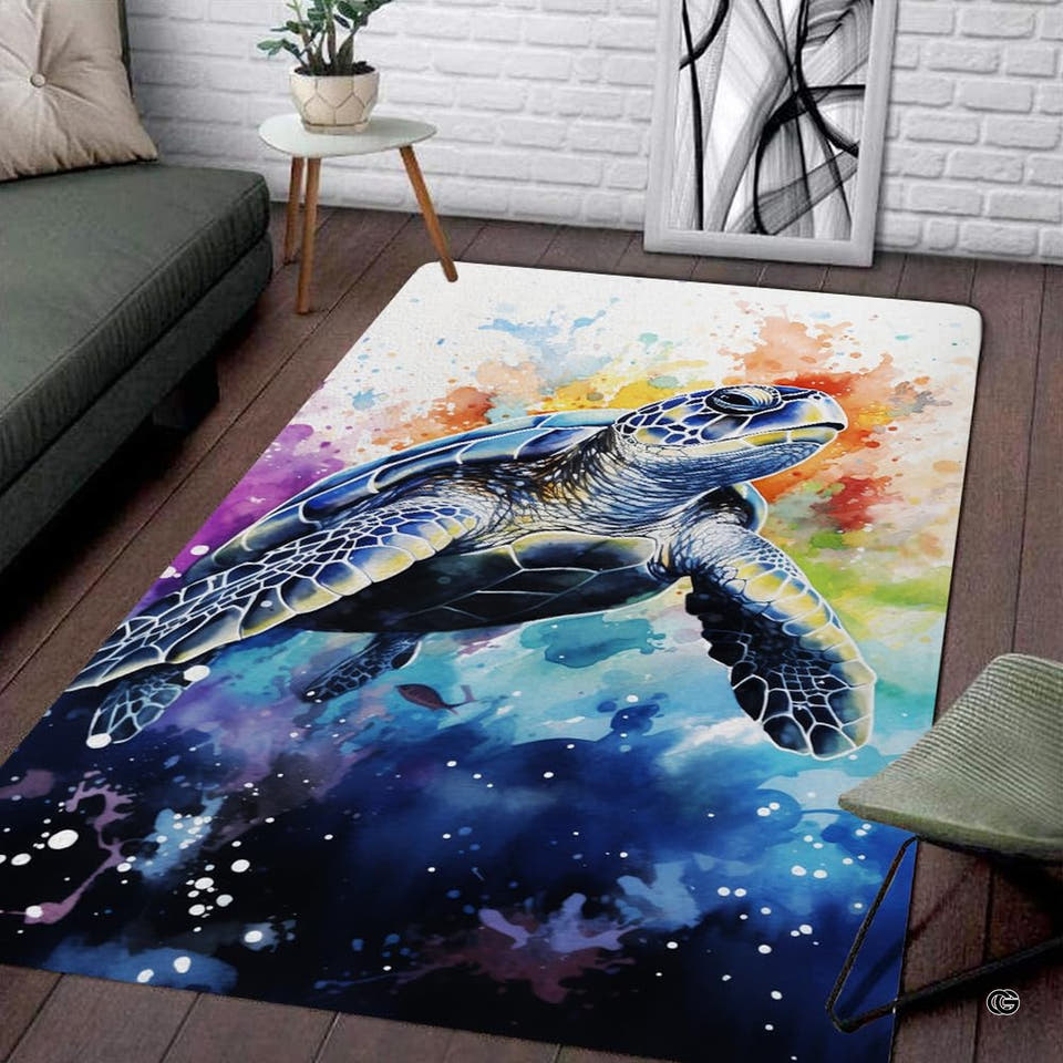 Vibrant blue area rug featuring an artistic sea turtle watercolor motif with splashing paint accents.