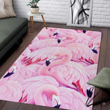 Pink flamingo flock pattern area rug displayed on neutral hardwood flooring.