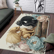 Cute golden and black baby dragons sitting on an antique leather book surrounded by soft pastel peonies area rug. - thumbnail image 2 of 5