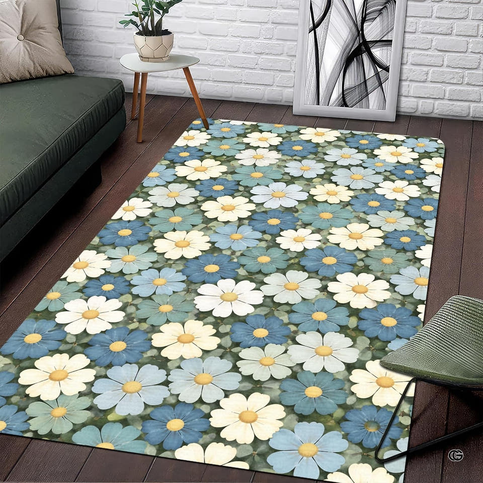 Daisy area rug displaying botanical blooms in muted blue, navy, cream, and thematic accent sage green.