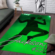Soccer player mid-air volley sports room area rug displayed on dark wood planks. - thumbnail image 1 of 7