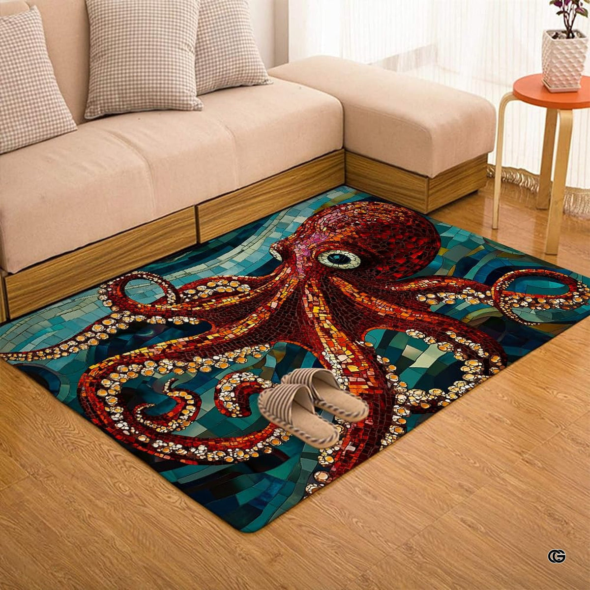 Overhead view of red octopus artwork and turquoise mosaic pattern on area rug.