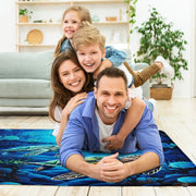 Bright sunroom setting with the swimming sea turtles rug centered on wood flooring - thumbnail image 5 of 7