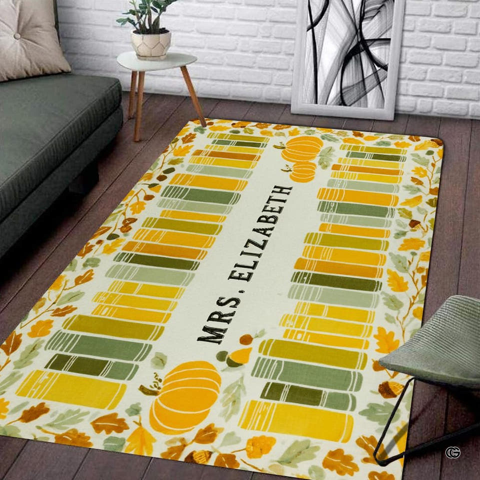 Area rug with autumn leaves, book stacks, and pumpkins on wood floor