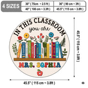 Top-down view of educational themed round area rug with retro pastel book spines and botanical blossoms. - thumbnail image 2 of 7