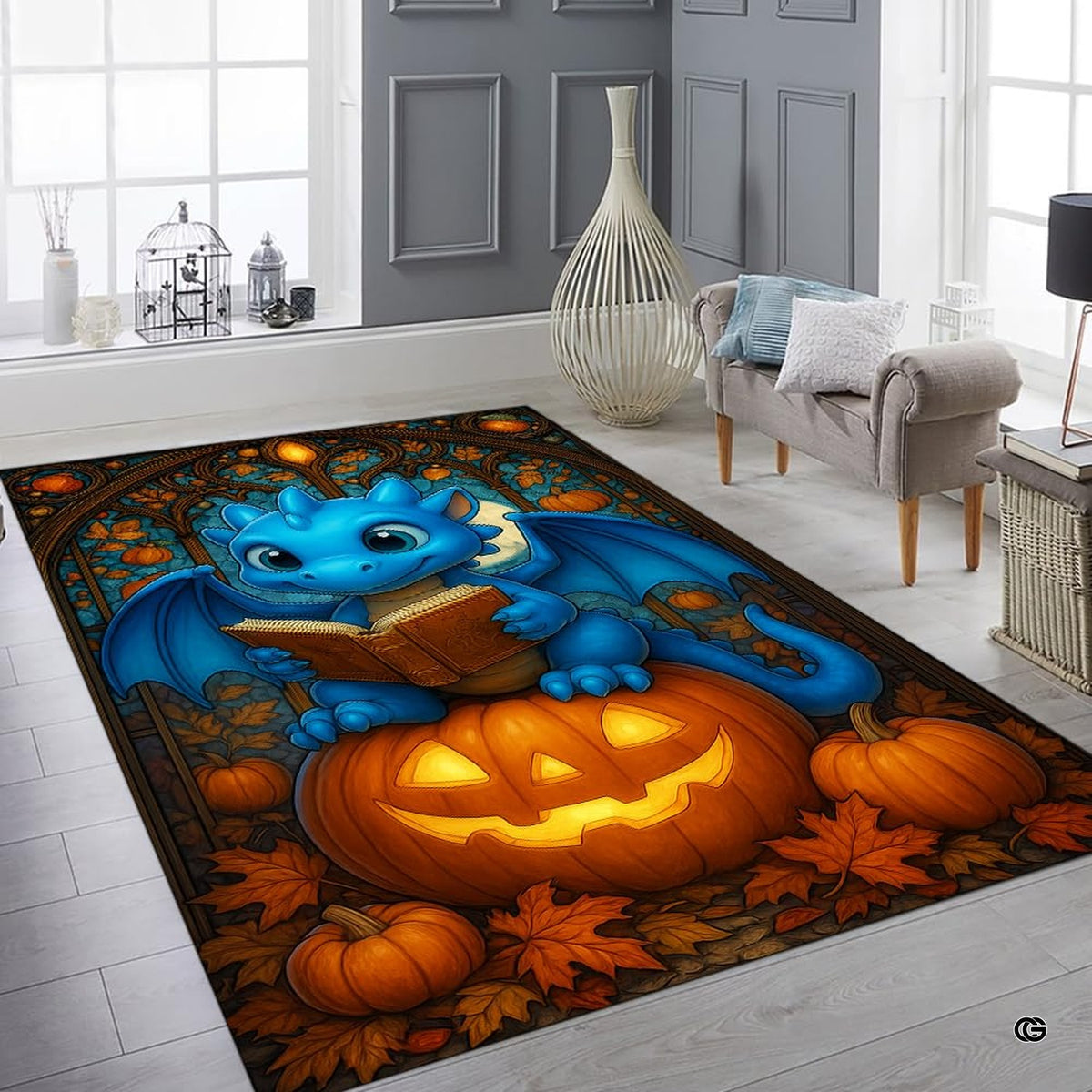 Cute blue baby dragon reading a book seated atop a glowing Halloween pumpkin surrounded by autumn leaves area rug.