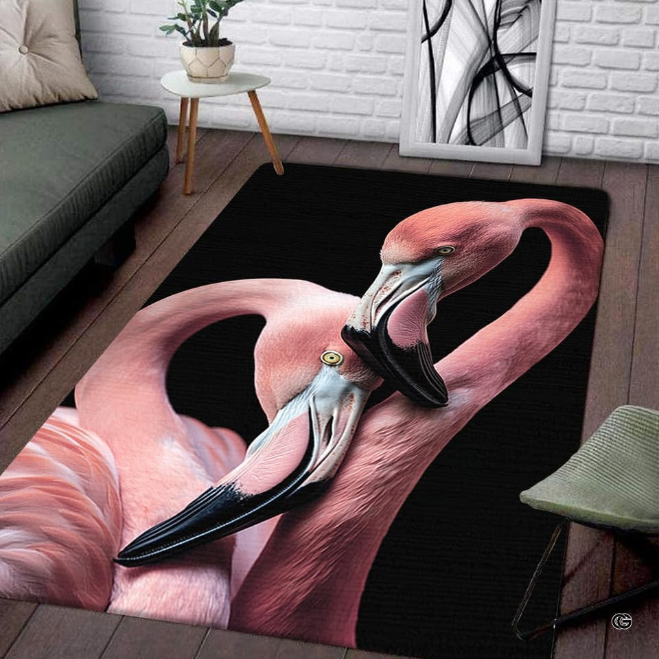 Living room display of a rectangular intertwined pink flamingos area rug on solid black background.