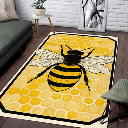 Overhead view of honey bee rug featuring black line art wings and amber geometric pattern. - thumbnail image 2 of 8